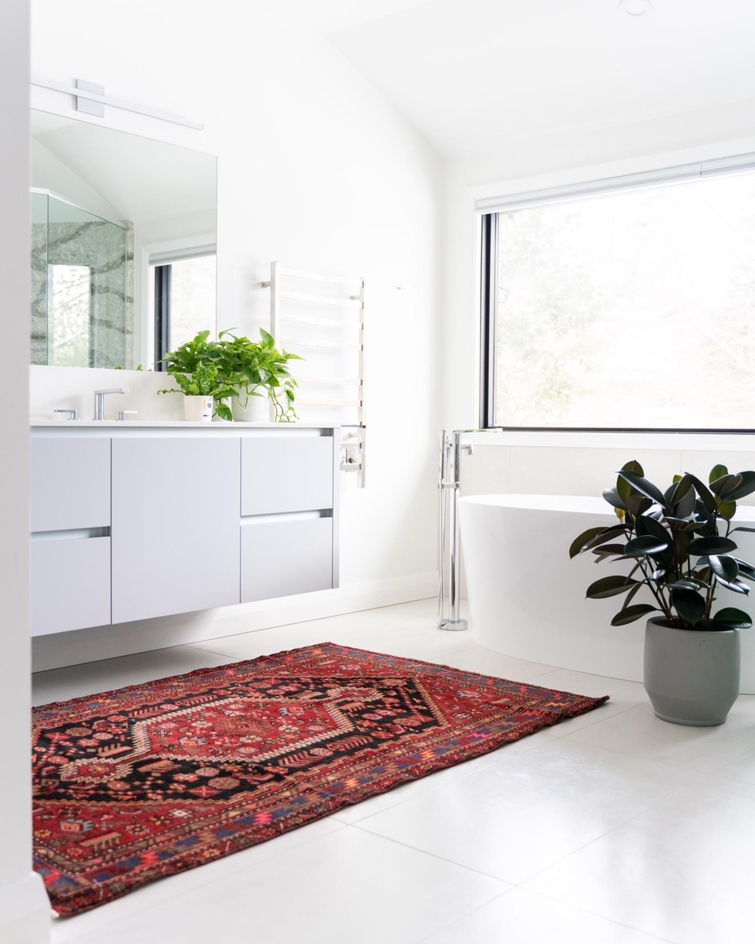 area rug in bathroom space by vanity